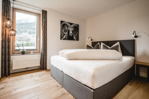 Кровать или кровати в номере Cabin8 Alpine Flair Apartments