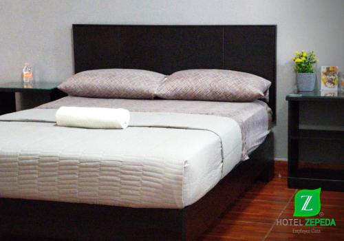 Ένα ή περισσότερα κρεβάτια σε δωμάτιο στο Hotel Zepeda