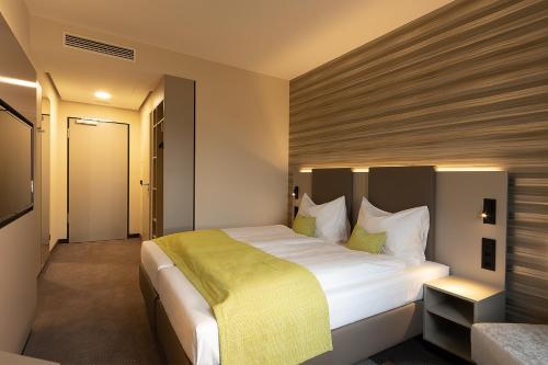 th Hotel Leipzig Messeにあるベッド