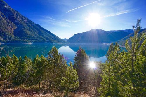 a view of crater lake from the shore of a mountain at Garni Das SONNALP in Maurach