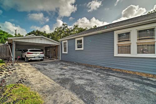 a car parked in a garage next to a house at Pet-Friendly Brenham Cottage with Yard! in Brenham