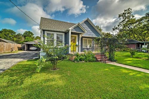 a small blue house with a yard with grass at Pet-Friendly Brenham Cottage with Yard! in Brenham