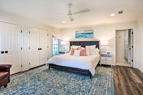 a bedroom with a bed and a ceiling fan at Idyllic Remodeled Lakefront Retreat with Fire Pit! in Malakoff