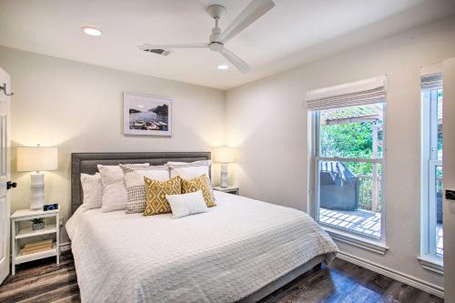 a bedroom with a bed and a window at Remodeled Cedar Creek Lake Retreat with Fire Pit! in Malakoff