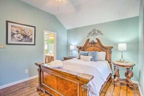 a bedroom with a large bed with a wooden frame at Family-Friendly Rowlett Home about 23 Mi to Dallas in Rowlett