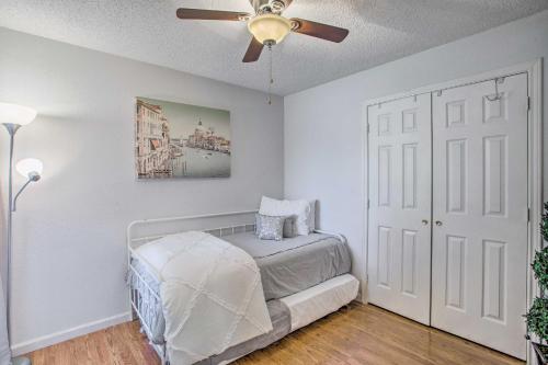 a bedroom with a bed and a ceiling fan at Family-Friendly Rowlett Home about 23 Mi to Dallas in Rowlett