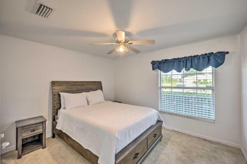 a bedroom with a bed and a ceiling fan at Ranch-Style Lehigh Acres House with Big Backyard! in Lehigh Acres