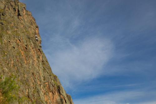 a rocky mountain with two birds sitting on it at Skylodge Adventure Suites in Urubamba