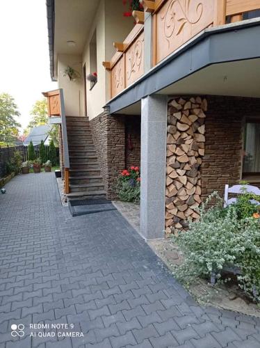 a building with a brick walkway in front of it at Apartamenty u Magika in Zakopane