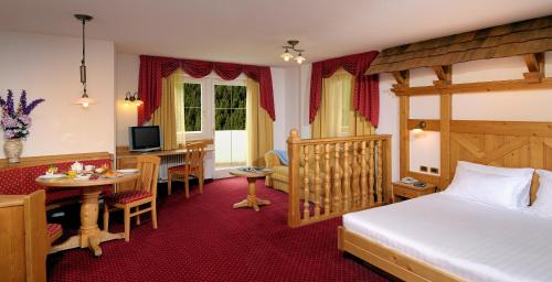 Postel nebo postele na pokoji v ubytování Hotel La Perla