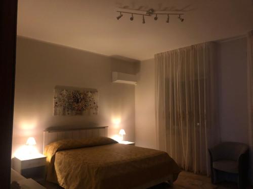 Postel nebo postele na pokoji v ubytování CASA DI LUCIA