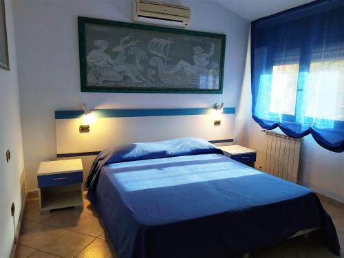 Postel nebo postele na pokoji v ubytování B&B Luna Blu