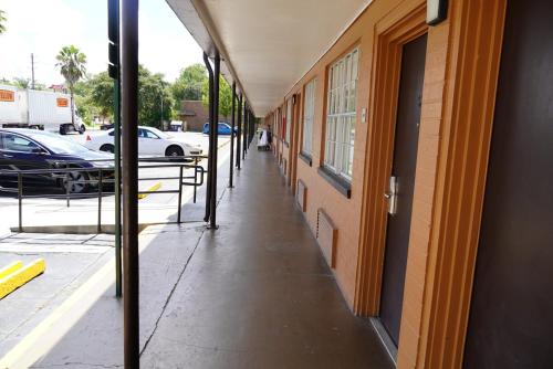 an empty hallway of a building with cars parked on a street at Econo Lodge Jacksonville South in Jacksonville