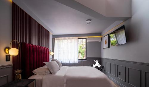 Ένα ή περισσότερα κρεβάτια σε δωμάτιο στο Casa Nada Hotel