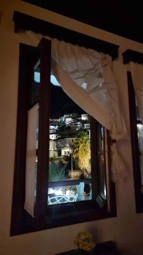 a window with a view of a city at Master Hotel in Berat