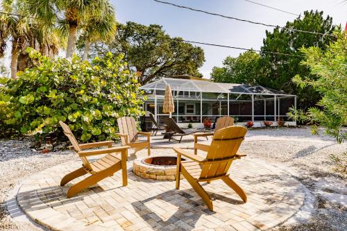 a group of chairs sitting around a fire pit at Siesta Key Island Rentals in Siesta Key