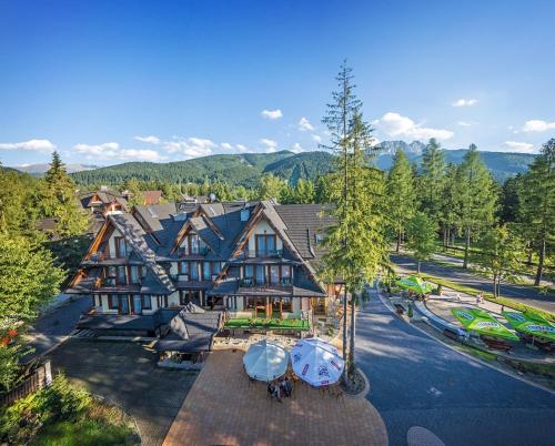 an aerial view of a large house with tents at Hotel Willa Pod Skocznią in Zakopane