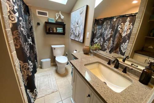 a bathroom with a sink and a toilet at Cabernet Cottage in Cottonwood