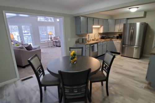 a kitchen and dining room with a table and chairs at Cindy's Super Ranch Home in West Chester