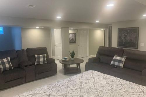 a living room with a couch and a table at Cindy's Super Ranch Home in West Chester