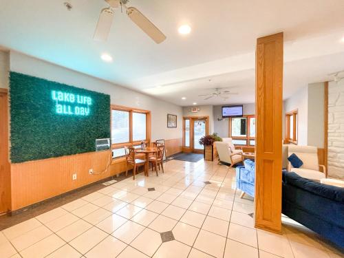 a living room with a large chalkboard on the wall at Lake Bluff Inn and Suites in South Haven