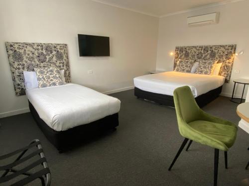 Ένα ή περισσότερα κρεβάτια σε δωμάτιο στο Batemans Bay Lodge