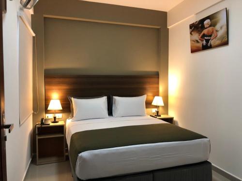 Postel nebo postele na pokoji v ubytování ikala Santa Cruz