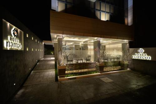 a store front of a building at night at Hotel Naman in Solapur
