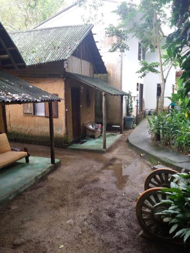 an outside view of a house with a porch at Canto do Riacho Chales in Trindade