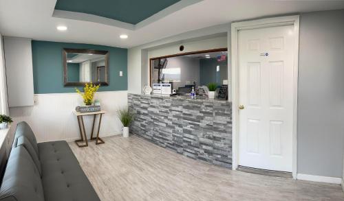 a lobby with a white door and a stone counter at Superlodge in Dover