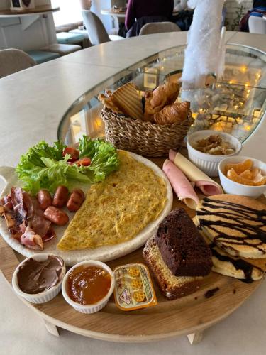 a plate of food on top of a table at Spon Boutique Hotel in Nafpaktos