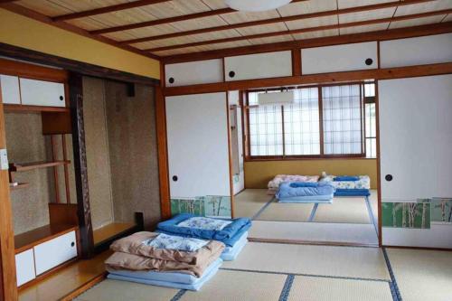 Llit o llits en una habitació de Japanestジャパネスト