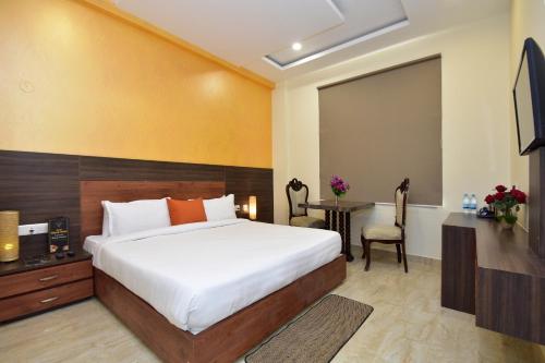 Tempat tidur dalam kamar di Hotel Bhaskar