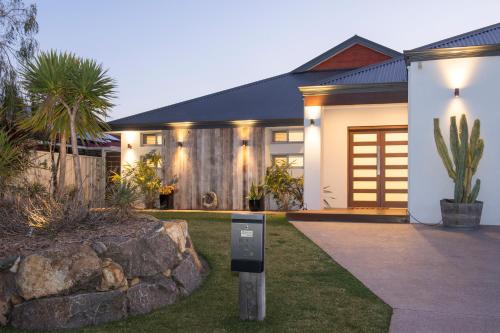 a house with a parking meter in front of it at Roanoke Retreat in Dunsborough