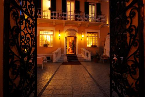 a hallway of a house with a staircase and a building at Hotel Villa Igea in Alassio