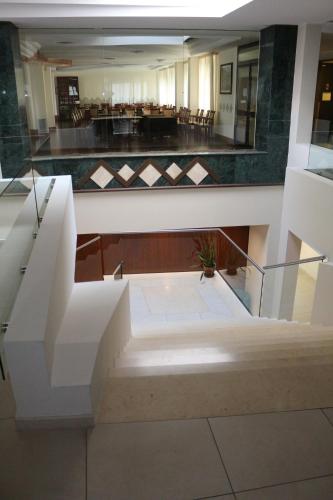 a view of a lobby with a staircase in a building at Hotel Mirasole International in Gaeta