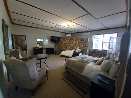 Телевизор и/или развлекательный центр в Die Windpomp Guesthouse