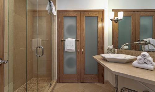 a bathroom with a shower and a sink at Townsend Place A107 Condo in Beaver Creek
