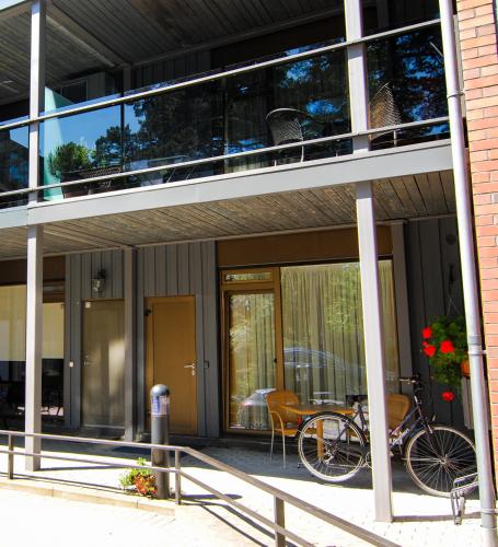 a bike parked on the balcony of a building at Saulės Krantas in Palanga