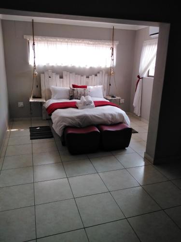 Кровать или кровати в номере Die Windpomp Guesthouse