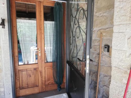 a door to a house with a window at Casa Martino in Villa