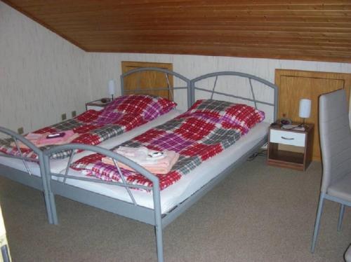 Un pat sau paturi într-o cameră la Ferienwohnung top Lage
