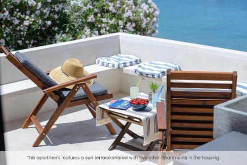 a person sitting in a chair on a patio at The Little Prince in Lopud Island