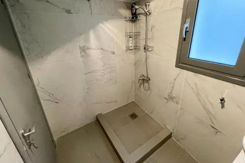 a bathroom with a shower with a glass door at ARTEMIS 1 Bdr Down Town Nicosia By Platform 357 in Nicosia