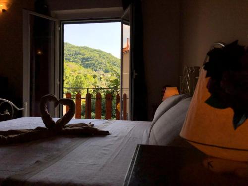 a bedroom with a bed with a view of a mountain at B&B La Casetta in Villa Santa Maria
