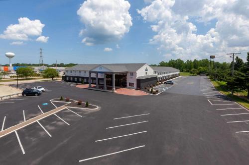 a parking lot in front of a large building at Days Inn by Wyndham Sandusky Cedar Point in Sandusky