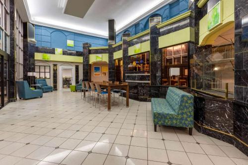 a room with chairs and a table in a building at Days Inn by Wyndham Sandusky Cedar Point in Sandusky