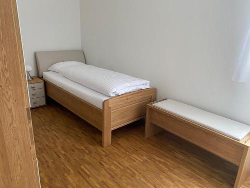 a small room with two beds and a table at Suite 32 in Oerlinghausen