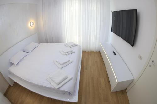 เตียงในห้องที่ Nicho Residence 2 Bucurestii Noi