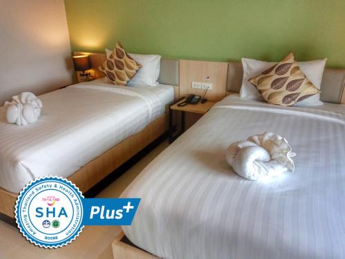 Ένα ή περισσότερα κρεβάτια σε δωμάτιο στο Louis' Runway View Hotel - SHA Extra Plus